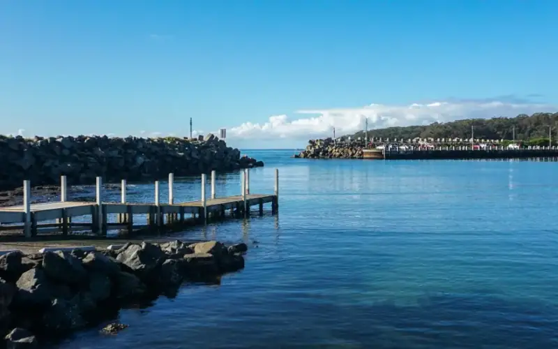 Ulladulla Harbour with the jetty and the fishing fleet