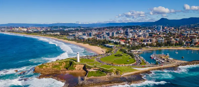 Wollongong from the air, the harbour and Flagstaff Point lighthouse below the escarpment